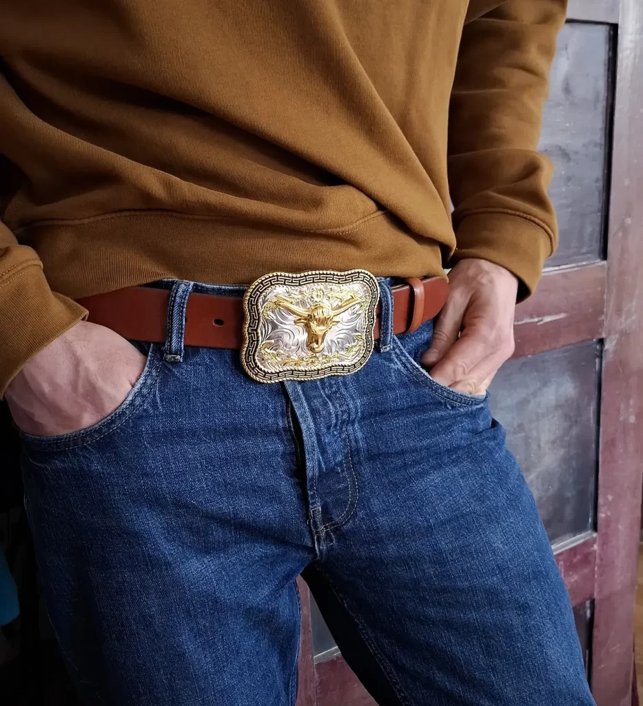 Man With Longhorn Buckle Belt And Blue Jeans