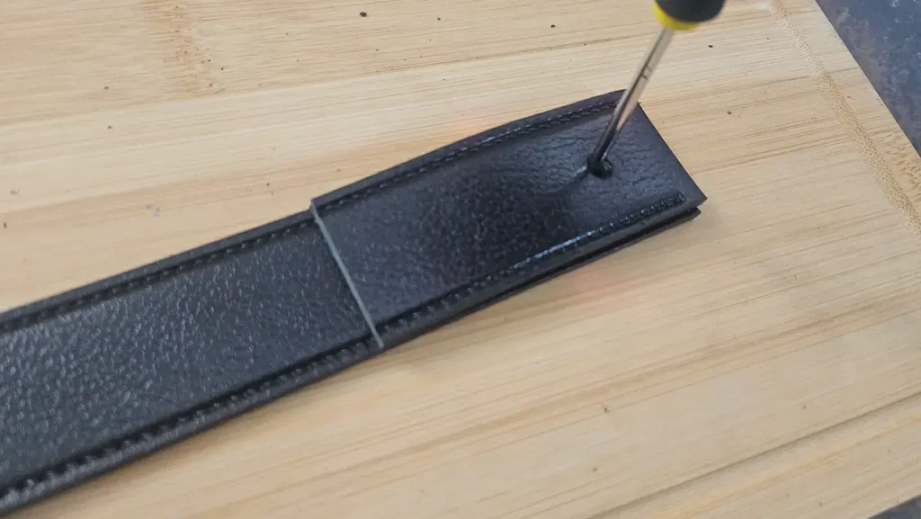 Step 5 Mark a New Hole for the Buckle Screw